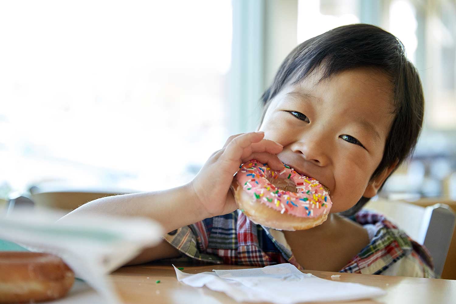 Japanese Girl eating doughnut shot by Karan Kapoor